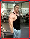 bodybuilder aaron reed black tank top gym triceps