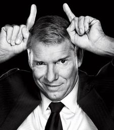 vince mcmahon devil horns b&w headshot suit tie