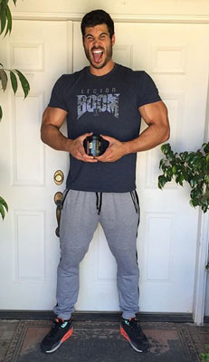 bodybuilder danny jones doorway smiling supplements tall
