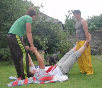 men clowning in backyard